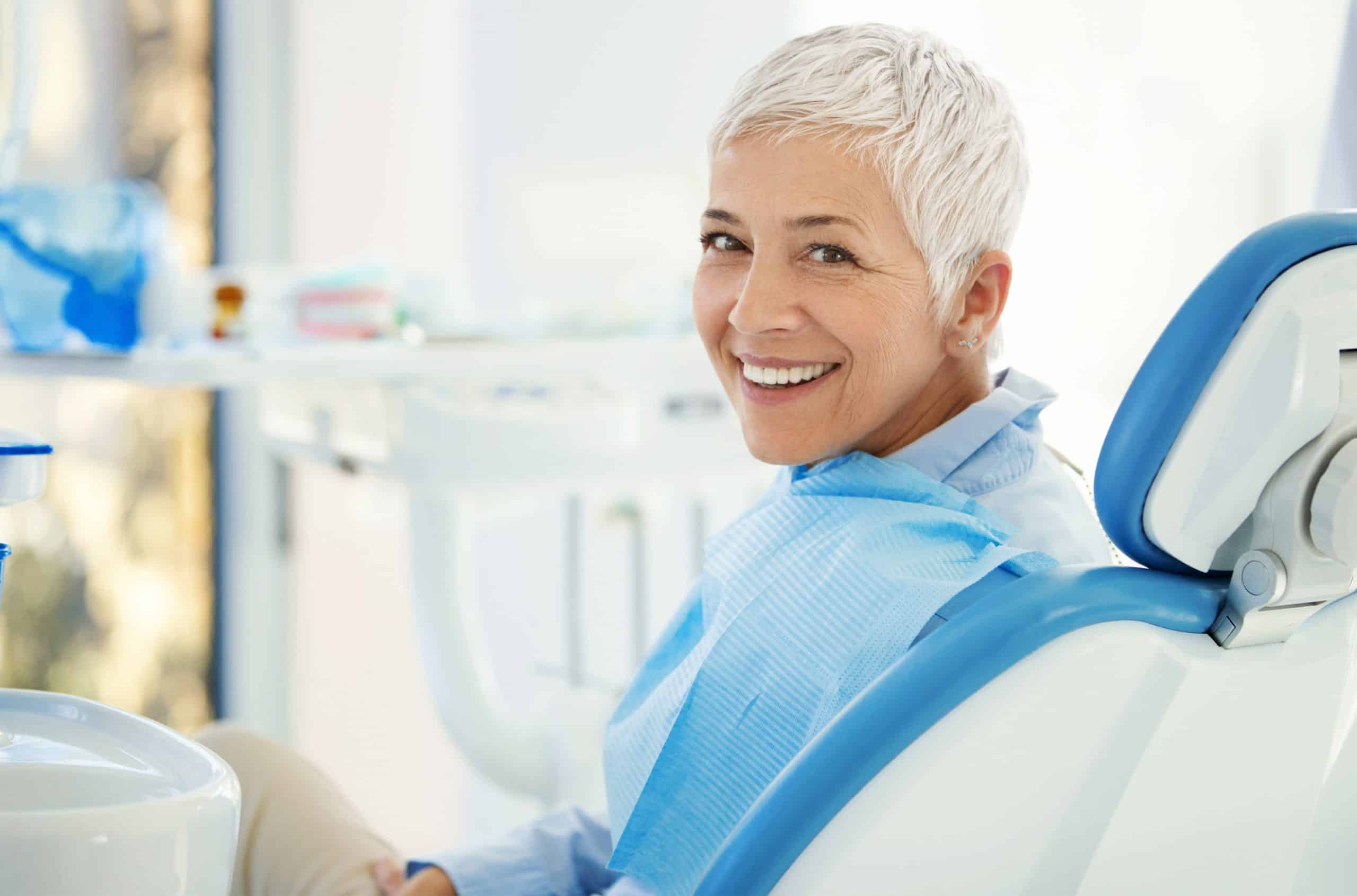 woman in dental chair getting dental restoration treatment.