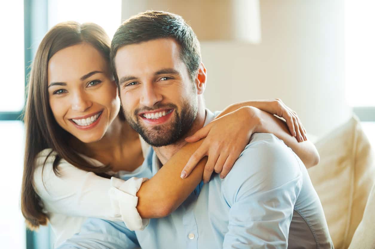 Couple smiling inside: Smile makeover with cosmetic dentistry in Washington, DC